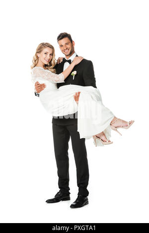 handsome young groom carrying his bride isolated on white Stock Photo