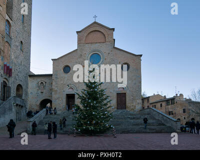 San Gimignano,Italy  2017 December 9: The Collegiate Church of Santa Maria Assunta or the Cathedral of San Gimignano is located in Piazza Duomo. It is Stock Photo