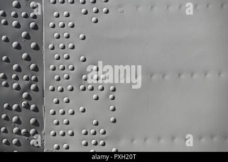 The texture of the metal of military equipment close-up shot. Stock Photo