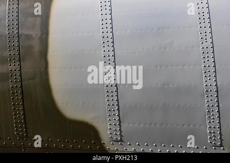 The texture of the metal of military equipment close-up shot. Stock Photo