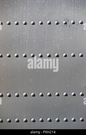 The texture of the metal of military equipment close-up shot. Stock Photo