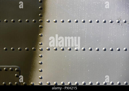 The texture of the metal of military equipment close-up shot. Stock Photo