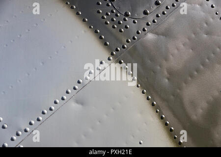 The texture of the metal of military equipment close-up shot. Stock Photo