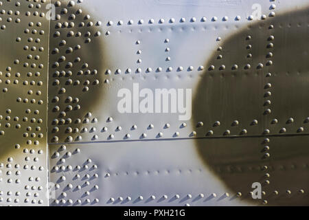The texture of the metal of military equipment close-up shot. Stock Photo