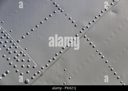 The texture of the metal of military equipment close-up shot. Stock Photo