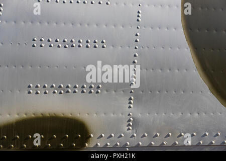 The texture of the metal of military equipment close-up shot. Stock Photo