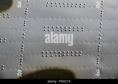 The texture of the metal of military equipment close-up shot. Stock Photo