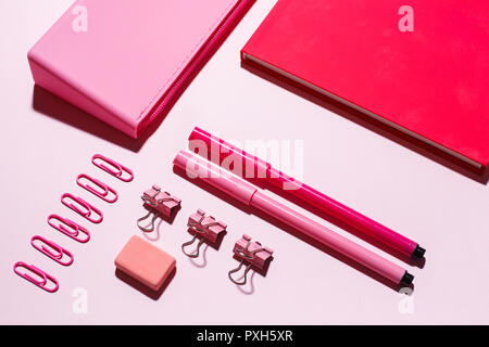 On the table there is a notebook, pencil case, markers. Stock Photo