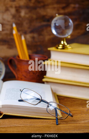 Open tutorial with glasses on the table in the audience Stock Photo