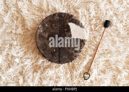 Traditional drum on white carpet Stock Photo