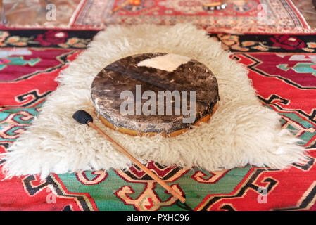 Traditional drum on white carpet Stock Photo