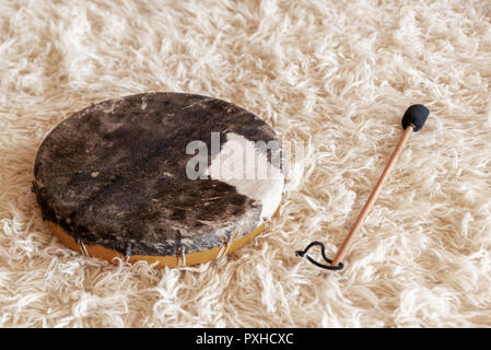 Traditional drum on white carpet Stock Photo