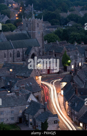Long exposure image showing vehicle light trails along East Street in the town of Corfe Castle, Dorset, England Stock Photo