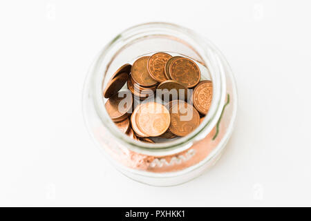 A glass bowl with 5 euro cent coins Stock Photo