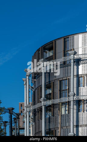 Iconic grade II listed gas holders re-used for housing at King's Cross in London. One of the towers has been converted into Gasholder Park. Stock Photo