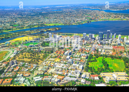 Aerial view of Perth Skyline and Heirisson Island in Australia. Scenic flight over the modern skyscrapers and Swan River in Western Australia.