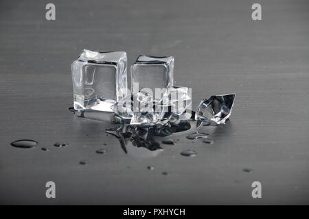 Melting ice on black surface Stock Photo