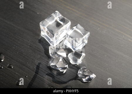 Melting ice on black surface Stock Photo