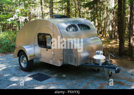 Teardrop trailer camper parked on a campsite. Stock Photo