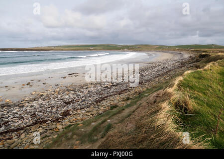 Sandy pebble beach in Orkney Stock Photo