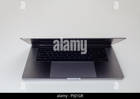 New high-speed thin grey aluminum laptop computer notebook front view with touchpad, keyboard  isolated on a white background Stock Photo