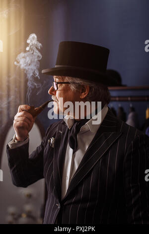 Portrait of posh mature gentleman visiting a tailor's shop Stock Photo