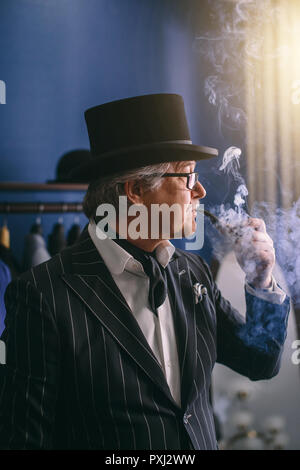 Portrait of posh mature gentleman visiting a tailor's shop Stock Photo