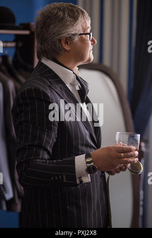 Portrait of posh mature gentleman visiting a tailor's shop Stock Photo