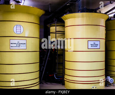 Edmont Fallot mustard fabrication in Beaune, France. The storage containers for Dijon mustard and Burgundy mustard stand side by side. The finished mustard rests here for 24 hours before it is bottled. Stock Photo