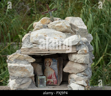 Shrine in Kato Theletra. The village was abandoned by its residents who relocated higher up the hillside after an earthquake caused landslide. Stock Photo