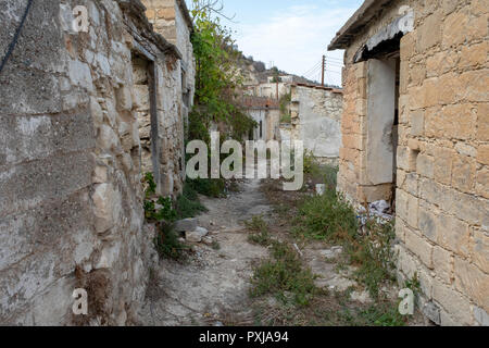 Kato Theletra or Old Theletra. The village was abandoned by its residents who relocated higher up the hillside after an earthquake caused landslide. Stock Photo