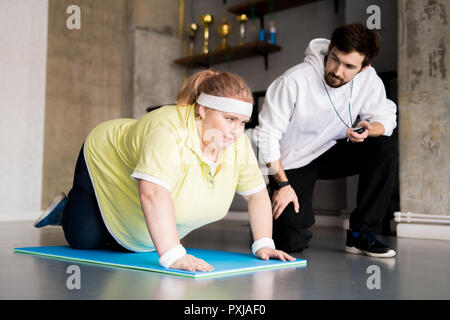 Obese Woman Doing Sports Stock Photo