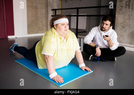 Overweight Young Woman Doing Sports Stock Photo
