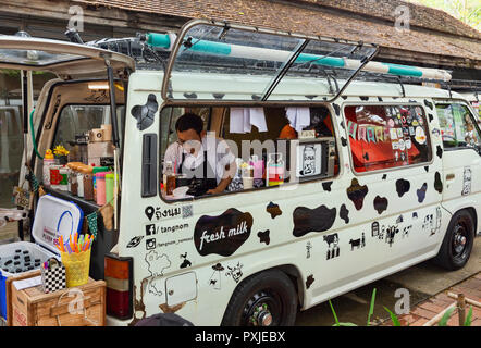 Van converted to mobile coffee shop at JingJai Farmer's Market, Chiang Mai, Thailand Stock Photo