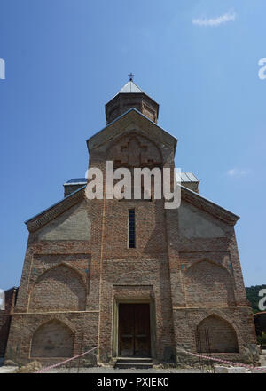 Telavi Akhali Shuamta Monastery Main Church with Crosses at the Facade and Blue Sky Stock Photo