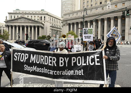 New York, USA, 22nd Oct, 2018.  Protesters call for an end to police brutality during a rally and march starting at  Foley Square in lower Manhattan.  It was one of dozens of similar events scheduled in cities across the U.S. to mark the 23rd Annual National Day of Protest to Stop Police Brutality, founded in 1996 by the October 22 Coalition. Credit: Joseph Reid/Alamy Live News Stock Photo