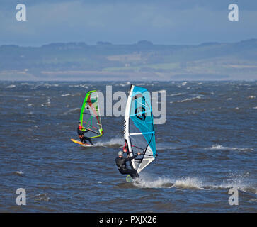 Gullane, East Lothian, Scotland, UK, 23 Oct. 2018 UK weather, 14 degrees with sunshine and winds of 44km/h and gusts of 57 km/h, windsurfers were taking advantage of the windy conditions Stock Photo