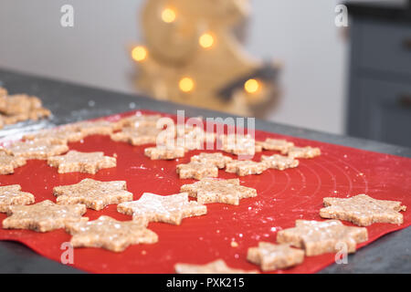 Star shaped cinnamon christmas cookies are ready for the oven. Stock Photo