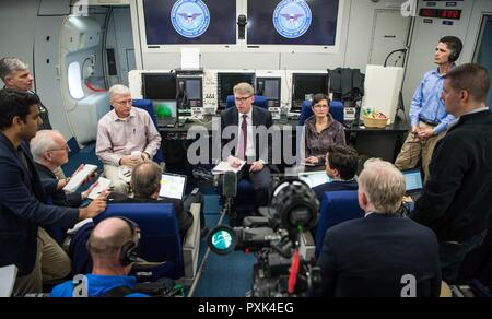 David Helvey, performing the duties of the assistant secretary of defense for Asian and Pacific security affairs, briefs reporters on Secretary of Defense Jim Mattis’ upcoming trip while flying en route to Singapore aboard an E-4B on June 1, 2017. Stock Photo