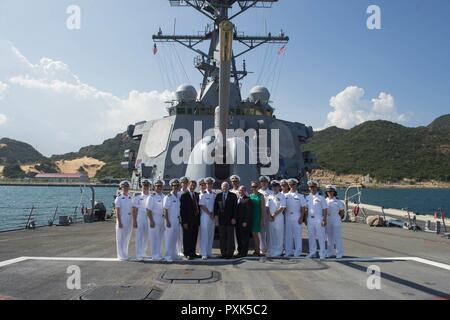 CAM RANH INTERNATIONAL PORT, Vietnam (Jun. 02, 2017) Senators John S. McCain III, Christopher Coons, and John Barrasso stand in front of the Mark 45 5-inch for a group photo during a visit to the Arleigh Burke-class guided-missile destroyer USS John S. McCain (DDG 56). The U.S. Navy has patrolled the Indo-Asia-Pacific routinely for more than 70 years promoting regional peace and security. Stock Photo