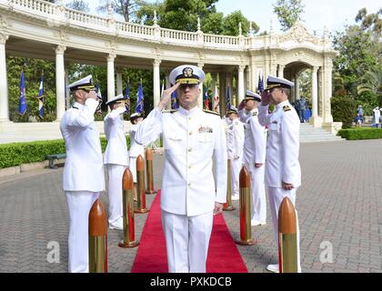 SAN DIEGO (June 08, 2017) Rear Adm. Paul Pearigen, commander, Navy Medicine West, and chief of the Navy Medical Corps, renders a salute to his side boys at the arrival of the official party during a professional education graduation ceremony at the Spreckels Organ Pavilion in Balboa Park. Professional Education's mission is to equip Naval Medical Center San Diego's individuals and teams to excel in their missions by providing leaner-focused mentoring, education and training, and facilitating mission-aligned research and scholarly activity. Stock Photo