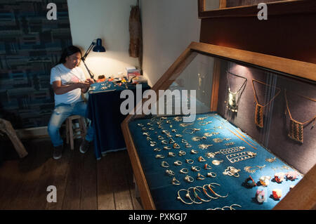 Ramiro Vargas Huaman working silver and copper in his studio in the San Blas district Stock Photo