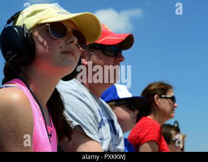 Spectators view an aerial demonstration during the Wings Over Whiteman air show at Whiteman Air Force Base, Mo., June 10, 2017. The air show featured performances by the Air Combat Command F-16 Viper Demonstration Team, the 442 Fighter Wing's A-10 Thunderbolt II, the Boeing B-29 Superfortress 'Doc', and more. Stock Photo