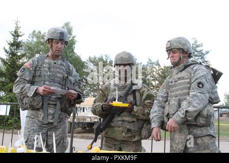 https://l450v.alamy.com/450v/pxkm9f/lt-col-jason-benson-ssg-klee-smith-and-pfc-george-ongoro-with-the-2-136th-combined-arms-battalion-cut-a-birthday-cake-in-honor-of-the-us-army-242nd-birthday-june-14-2017-in-pabrade-lithuania-croatian-norwegian-lithuanian-german-portuguese-and-army-national-guard-forces-from-pennsylvania-and-minnesota-also-joined-them-during-the-celebration-during-exercise-iron-wolf-17-pxkm9f.jpg