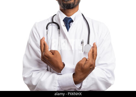 Close-up of crossed fingers as good luck concept by indian male doctor or medic isolated in white background Stock Photo