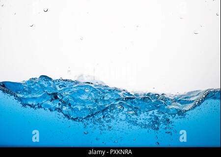 Waves of clear blue water and bubbles Stock Photo
