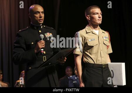 Maj. Jared Reddinger (Left) delivers a speech to Westview High School's Junior Reserve Officer's Training Corps to recognize Danny Viboch for receiving the Semper Fi All American Award. Viboch is one of two high school juniors to receive this award in San Diego and one of ninety-eight in America. Viboch will be sent to Washington D.C. this summer with his mother, who he feels has been a big part in his academic and athletic success, to attend the Battles Won campaign. Reddinger, from Chewelah, Washington, is the commanding officer for Recruiting Station San Diego, 12th Marine Corps Recruiting  Stock Photo