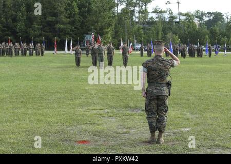 U.S. Marine Corps Lt. Col. Todd B. Sanders salutes during the Combat Logistics Battalion 22 change of command ceremony at Soifert Field on Camp Lejeune, N.C., June 16, 2017. During the ceremony, Sanders relinquished command to Lt. Col. Sean P. Mullen. Stock Photo