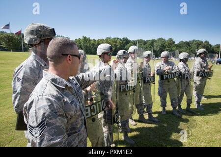 Staff Sgt. Shane Howell, 164th SFS Security Forces Journeyman, provides instruction during Domestic Operations (DOMOPS) drills at Memphis Air National Guard Base, Tenn., Jun. 11, 2017. Recurring DOMOPS training is required to be ready for crowd control taskings. Stock Photo