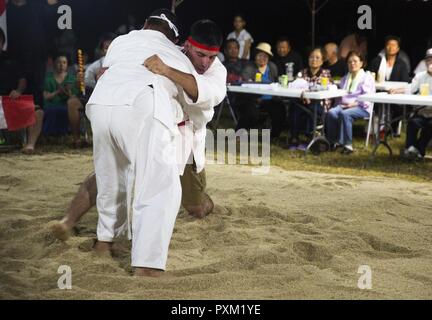 https://l450v.alamy.com/450v/pxm1ye/lance-cpl-giovanni-l-ramires-right-center-leg-sweeps-his-opponent-june-10-2017-during-the-annual-henoko-okinawa-style-sumo-tournament-at-mae-no-hama-field-in-henoko-okinawa-japan-during-a-bout-competitors-try-to-earn-points-by-making-their-opponent-fall-into-the-dohyo-or-sandy-pit-without-striking-or-letting-go-of-each-others-belts-the-first-to-gain-two-points-is-the-victor-okinawa-style-sumo-wrestling-also-known-as-kakuriki-is-a-combination-of-western-wrestling-and-traditional-japanese-sumo-and-judo-according-to-fumio-iha-camp-schwabs-community-relations-specialist-ram-pxm1ye.jpg